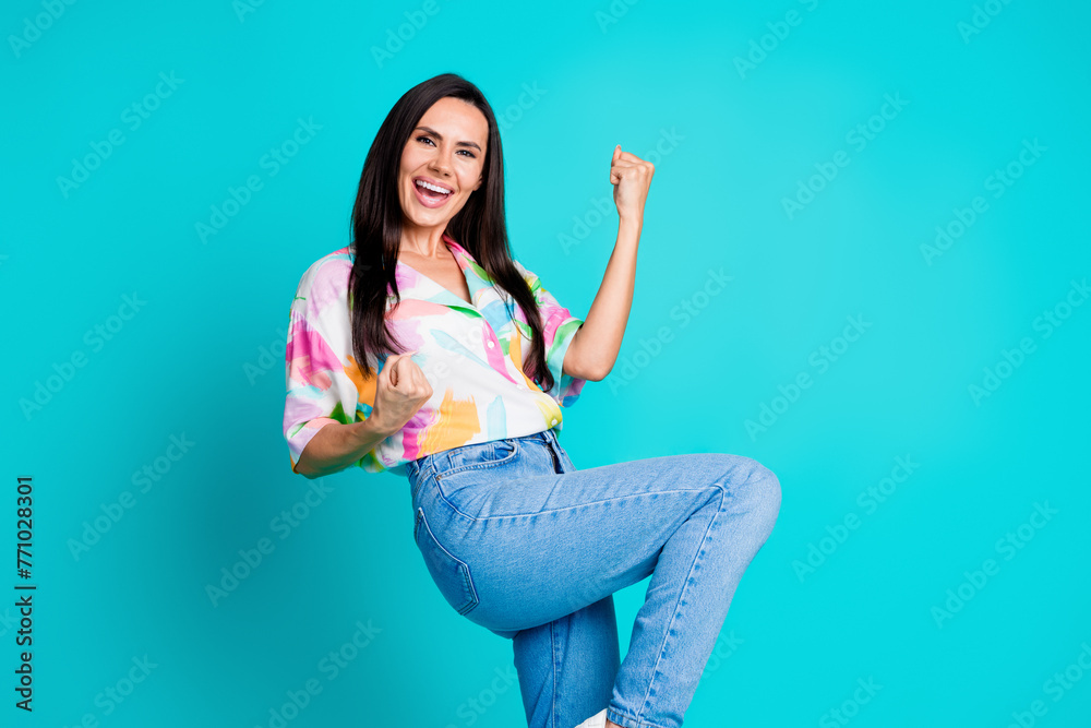 Photo of nice lady raise fists accomplish empty space wear shirt isolated on turquoise color background - obrazy, fototapety, plakaty 