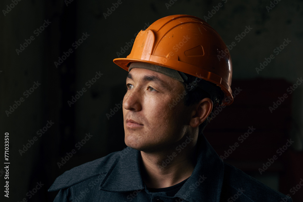 Portrait of a man wearing a work helmet Portrait of a man wearing a work helmet