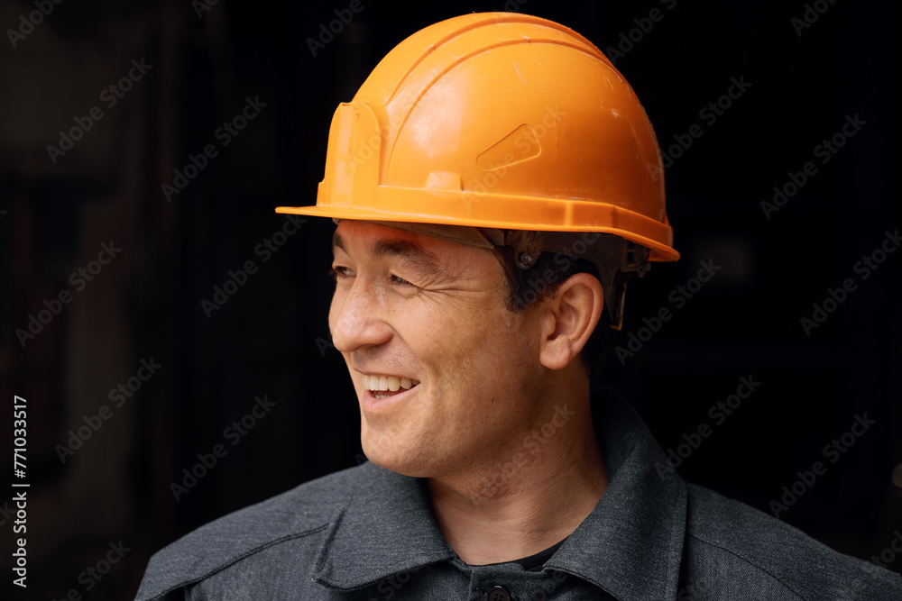 Portrait of a man wearing a work helmet Portrait of a man wearing a work helmet