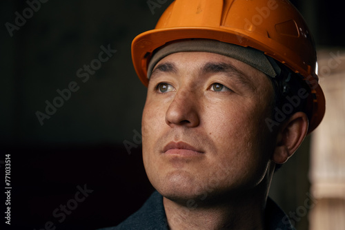Portrait of a man wearing a work helmet photo