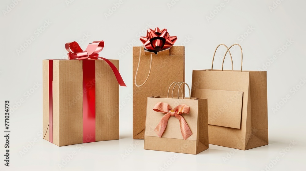 Obraz premium gift packaging and paper bags.gift box decorated with red ribbon, one small bag with orange ribbon, and two brown paper bags without decoration.AI generated image