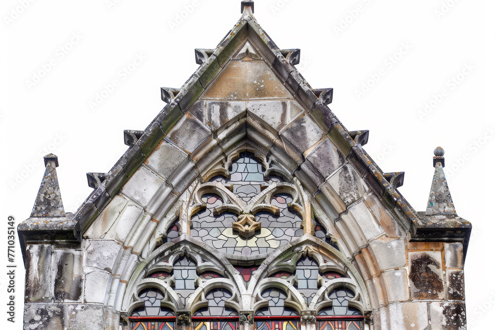 A detailed view of a Gothic window, its weathered stone and stained glass contrasting sharply with the clean white background