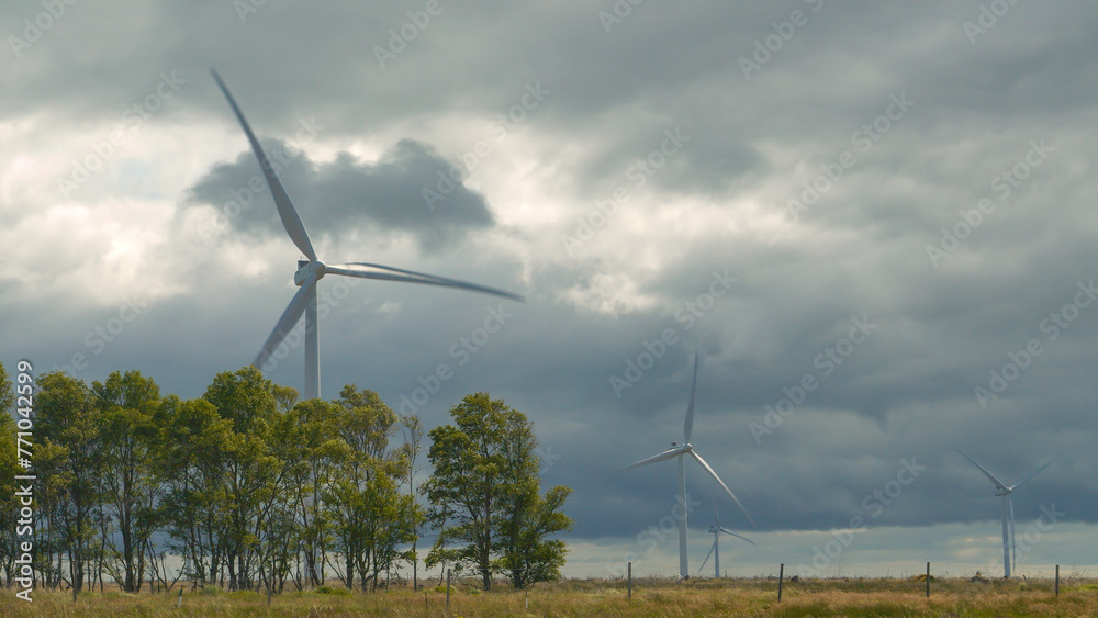 Operating wind powered structures located in remote part of Scottish countryside - obrazy, fototapety, plakaty 
