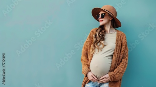 Pregnant woman with a belly bump enjoying life outdoors with loose-fitting and fashionable clothing