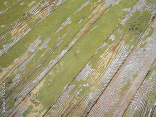 Texture of old gray green wall of diagonal wooden boards, close up