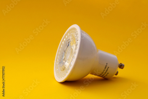 LED bulb sideways on yellow background