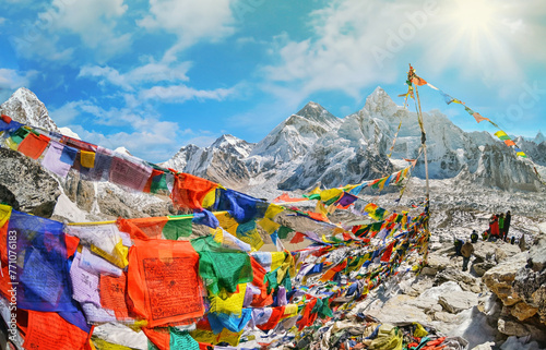 View of Mount Everest and Nuptse  with buddhist prayer flags from kala patthar in Sagarmatha National Park in the Nepal Himalaya photo