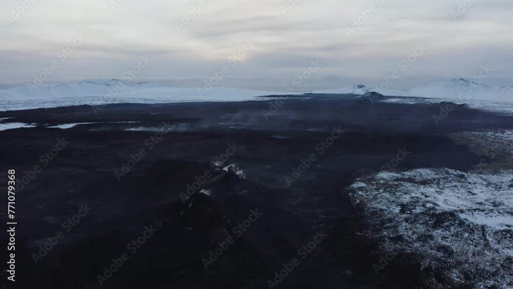 Aerial video on hot earth - lava in Iceland in a snowy winter Aerial video on hot earth - lava in Iceland in a snowy winter