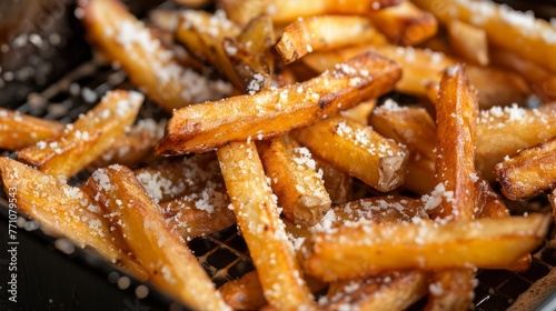 Close up of mouthwatering golden crispy french fries being cooked in a deep fryer