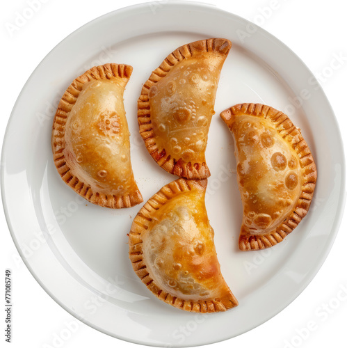 Golden baked empanadas on white plate isolated cut out on transparent background