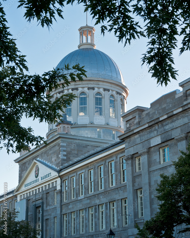 The iconic Bonsecours Market in Montreal basks in the daylight, its distinguished architecture standing as a testament to the city's rich history and vibrant culture.