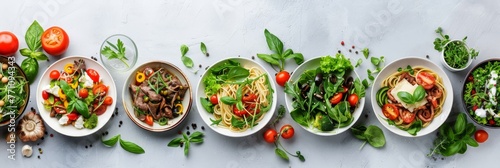 Assorted spaghetti dishes with various pastas and sauces, elegantly displayed on white background