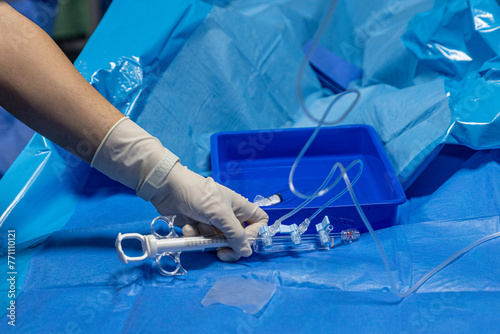 The procedure of inserting a double lumen catheter into a patient with cardiovascular occlusion in the hospital. Doctor insert double lumen catheter. insert guide wire.
