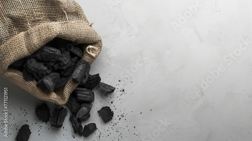 Black coal in a jute sack photo