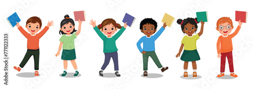 Group of little kids students holding books in their hands