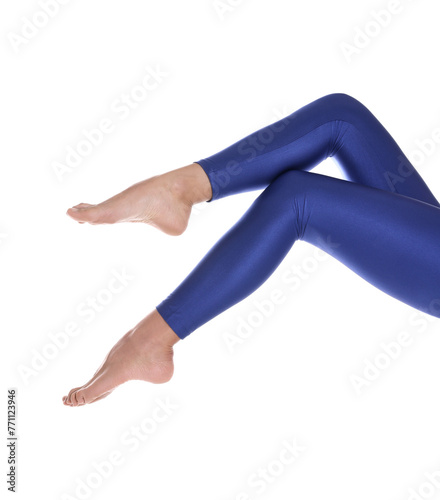 Woman with beautiful long legs wearing blue leggings on white background, closeup