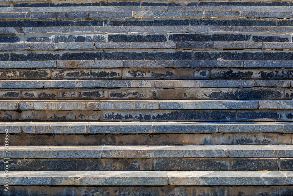 The image is of a stone staircase with a blue and white color scheme The image is of a stone staircase with a blue and white color scheme