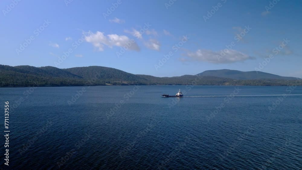 Landing Craft Sailing On Tasman Sea In Bruny Island, Tasmania, Australia. wide aerial shot Landing Craft Sailing On Tasman Sea In Bruny Island, Tasmania, Australia. wide aerial shot