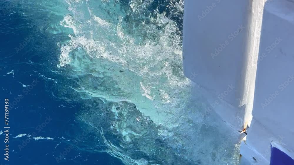 Fishing Boat Rutter Close up of rudder on the stern of a fishing boat speeding through deep ...
