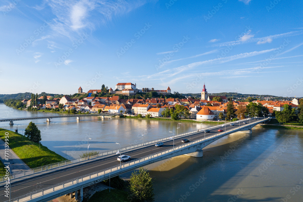 Obraz premium Ptuj, Slovenia - Aerial sunset view above the Slovenian village of Ptuj and the Drava river