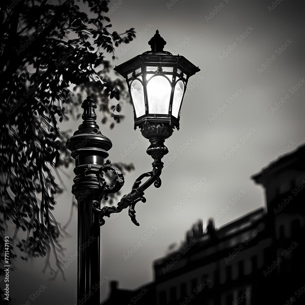 A black and white image of an old-fashioned street lamp