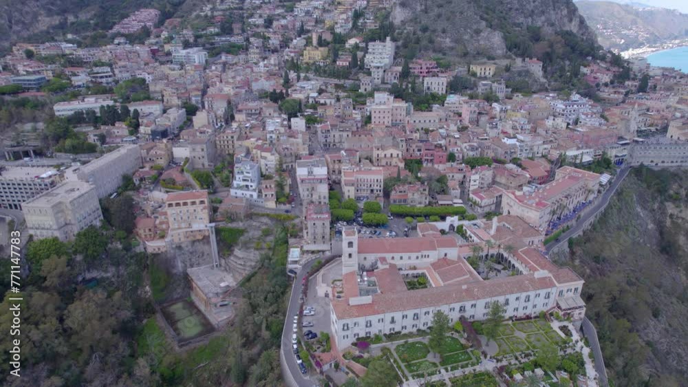 Aerial orbit over Taormina, Sicily, Italy a famous tourist destination, south side of the city Aerial orbit over Taormina, Sicily, Italy a famous tourist destination, south side of the city