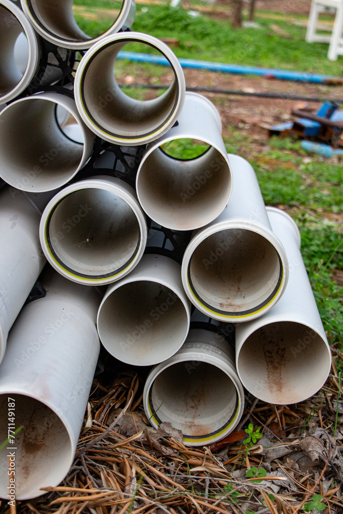 Close up of plastic pipes for water supply system in the garden. Plastic pipes for the construction of the house. Close up of plastic pipes for water supply system in the garden. Plastic pipes for the construction of the house.