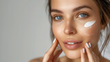 A woman with a face covered in an excessive amount of cream, showcasing a whimsical and surreal beauty routine, Hydration. Cream smear. Beuaty close up portrait of young woman with a healthy glowing s