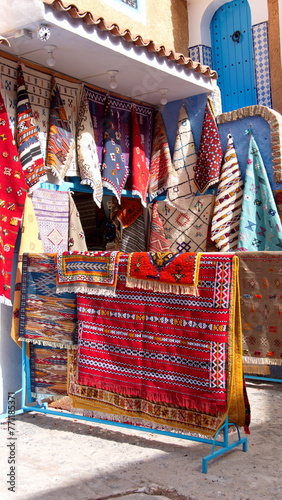 Colorful textiles on display in Chefchaouen, Morocco © Angela