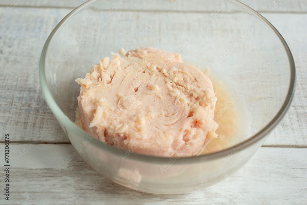 A view of a glass bowl of canned tuna. A view of a glass bowl of canned tuna.