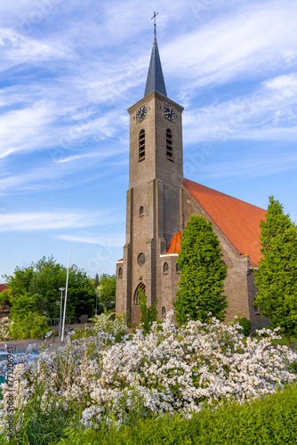 Historic church R.K. Parochie Heilige Bavo in Ursem city, Netherlands. photo