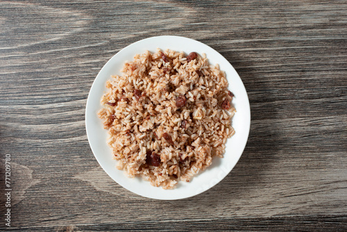 A top down view of a plate of rice and peas. photo