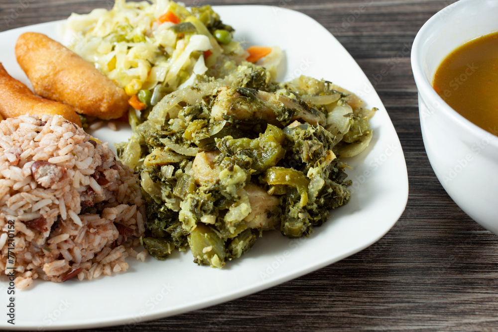 A view of a callaloo and saltfish meal. A view of a callaloo and saltfish meal.