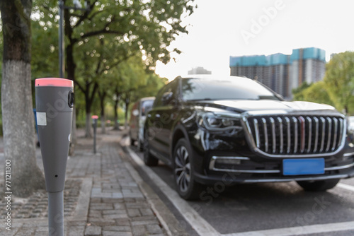 Modern intelligent parking timing and toll collection equipment, with cars parked on the roadside automatically sensing timing and toll collection