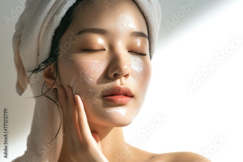 The picture of the asian woman using the face treatment  the young beautiful girl has been using facial treatment for skin care of her face  the white lady facial treatment for the moisture. AIGX01.
