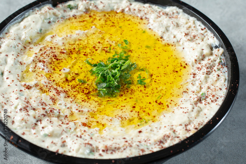 A closeup view of a bowl of mutabal. photo