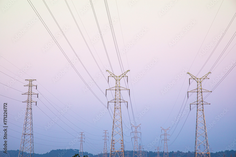The high-voltage electric tower appears very majestic and spectacular in the sky