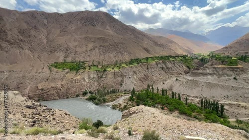 Beautiful Karatag and Piron valleys in the Fan Mountains. Panorama of the deep valley of the Zeravshan River. The Zarafshan and Hissar ranges are located near the mountain village of Aini. Pamir photo