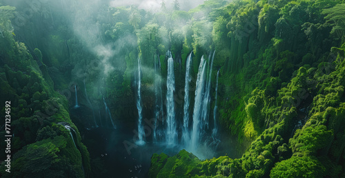 Waterfall in bali, waterfall with green plants and water flow from the top to bottom