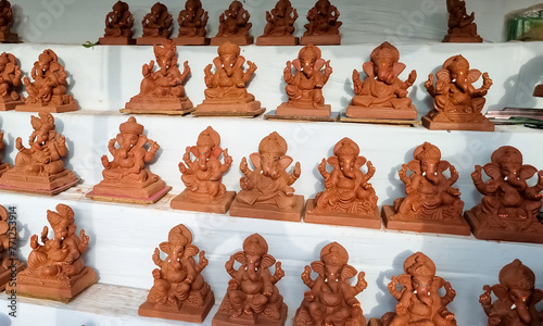 Shadu mati Ganesha murtis idols during Ganeshotsav display in shop and market photo