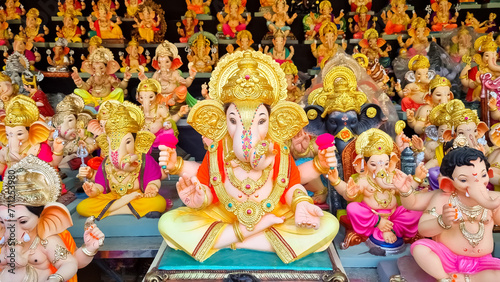 Beautiful Ganesha murtis idols during Ganeshotsav display in shop and market photo