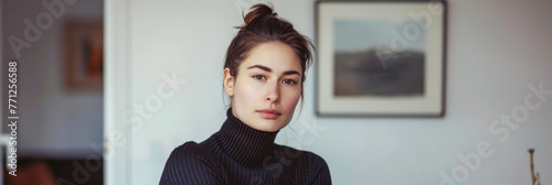 Young woman portrait posing for the camera at her home photo