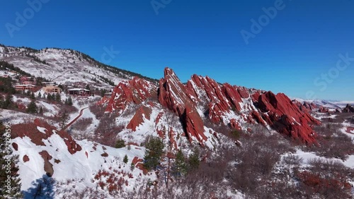 March winter morning after snowfall stunning Roxborough State Park Colorado aerial drone landscape sharp jagged dramatic red rock formations Denver foothills front range blue sky downward motion photo