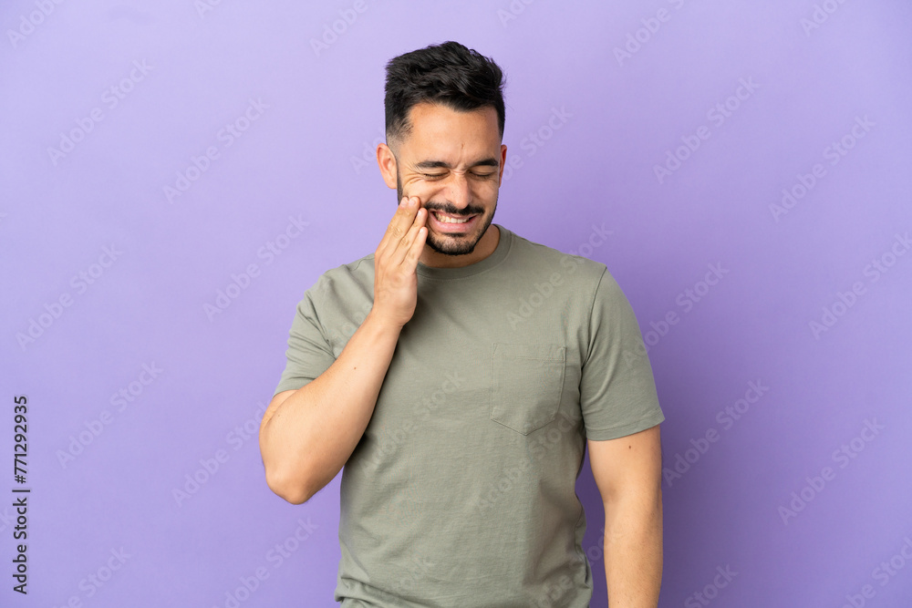 Young caucasian man isolated on purple background with toothache Young caucasian man isolated on purple background with toothache