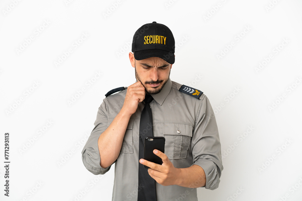 Young security  caucasian man isolated on white background thinking and sending a message