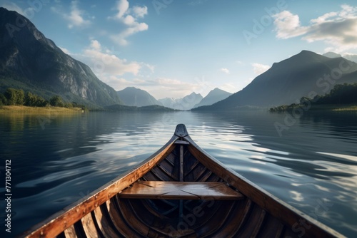 Wooden canoe on a calm lake with mountains