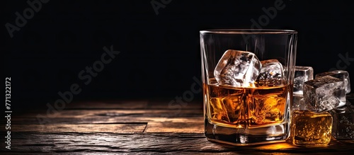 Glass filled with whisky, a...
