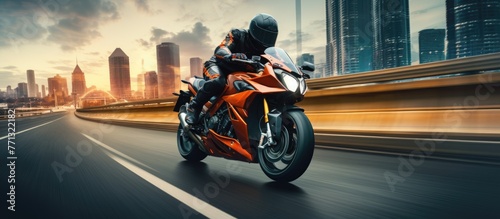 A motorcyclist is riding on...
