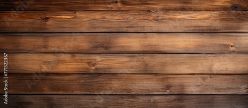 A detailed view of a wooden wall displaying a rich brown stain, adding character and warmth to the interior