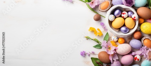 A beautiful arrangement in a bowl featuring assorted flowers and eggs  ideal for Easter decoration